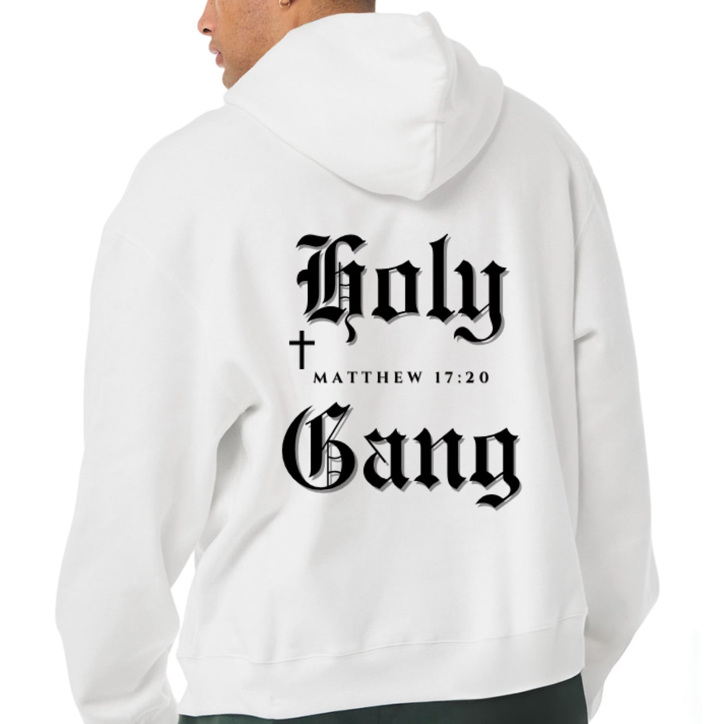 Back of male model a white Holy Gang hoodie with black gothic logo, cross and Matthew 17:20 verse.