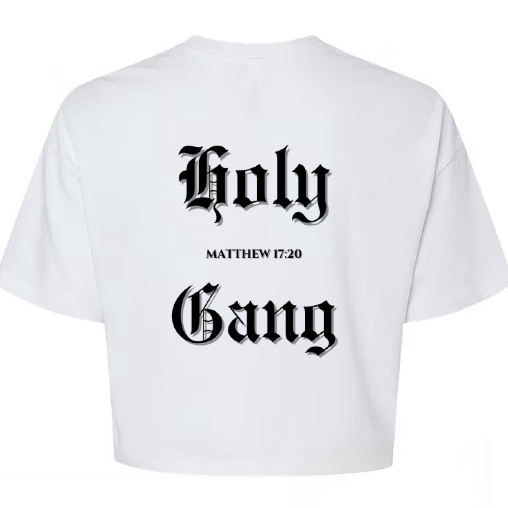 White Cropped T-shirt laid flat with the words "Holy Gang" printed in black Old English font on the back, and the Bible verse reference "Matthew 17:20" centered between the words.