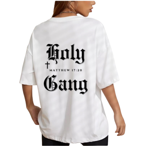 Back of female model wearing a white Holy Gang oversized t-shirt with black gothic logo, cross and Matthew 17:20 verse. 